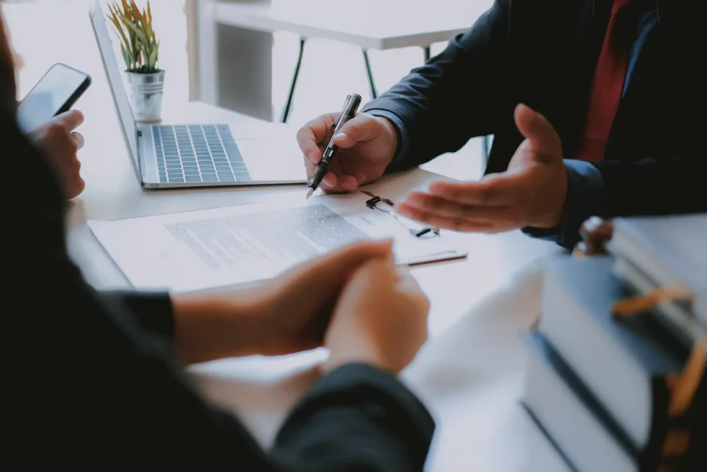 People signing estate planning documents